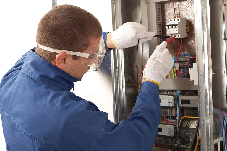 Electrician fixing wiring in a domestic property